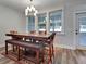 Dining area with seating for six, natural light, and access to the outdoors at 1543 Scott Hill Rd, James Island, SC 29412