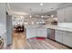 Bright and airy kitchen with granite countertops, gray cabinets, and stainless appliances at 1543 Scott Hill Rd, James Island, SC 29412