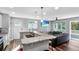 Cozy open-concept space with a modern kitchen featuring granite countertops and a seamless transition to the living area at 1543 Scott Hill Rd, James Island, SC 29412