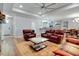 Open living room with leather seating, a fireplace, and access to kitchen and dining areas at 1543 Scott Hill Rd, James Island, SC 29412