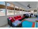Bright sun room with lots of natural light, ceiling fans and comfortable seating at 1543 Scott Hill Rd, James Island, SC 29412