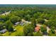 Expansive aerial view showcasing the property nestled among lush green trees, near the city at 171 N Main St, Ridgeville, SC 29472