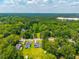 Scenic aerial view showing the property nestled among the trees in a quiet neighborhood at 171 N Main St, Ridgeville, SC 29472