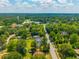 High aerial view showing the property nestled in a quiet neighborhood, with a water tower in the distance at 171 N Main St, Ridgeville, SC 29472