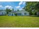 Spacious backyard with lush green lawn, perfect for Gathering gatherings and outdoor fun at 171 N Main St, Ridgeville, SC 29472