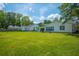 Expansive backyard with a well-maintained lawn, perfect for outdoor activities and relaxation at 171 N Main St, Ridgeville, SC 29472