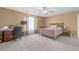 Bedroom with ceiling fan, study desk, and natural light that provides a welcoming space at 171 N Main St, Ridgeville, SC 29472