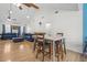 Open concept dining area with a dining table and an opening into a living room at 171 N Main St, Ridgeville, SC 29472
