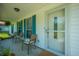 Inviting front porch with seating and charming architectural details at 171 N Main St, Ridgeville, SC 29472