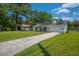 Charming single-story home featuring solar panels and a well-manicured lawn at 171 N Main St, Ridgeville, SC 29472