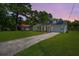 Charming single-story home featuring solar panels and a well-manicured lawn at 171 N Main St, Ridgeville, SC 29472