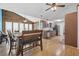 Open concept kitchen and dining area with stainless steel appliances and a ceiling fan at 171 N Main St, Ridgeville, SC 29472