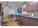 Traditional kitchen features stainless steel appliances, wood cabinets, and granite countertops at 171 N Main St, Ridgeville, SC 29472