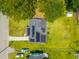 Aerial view of a home featuring a roof with solar panels, adjacent to a well-maintained green lawn at 171 N Main St, Ridgeville, SC 29472