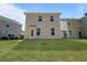 The backyard features a lush green lawn, a small patio, and plenty of space for outdoor activities at 1800 Poplar Grove Pl, Summerville, SC 29483