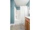 Cozy bathroom features walk-in shower and wood cabinets with modern fixtures at 1813 Parkland Preserve Ln, Charleston, SC 29412
