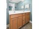 Bathroom features double sinks with wood cabinets and neutral paint at 1813 Parkland Preserve Ln, Charleston, SC 29412