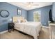 Cozy bedroom with neutral walls and large windows offering ample natural light at 1813 Parkland Preserve Ln, Charleston, SC 29412