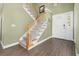 Inviting entryway with hardwood floors, stairs leading to upper level, and bright natural light at 1813 Parkland Preserve Ln, Charleston, SC 29412