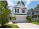 Charming two-story home with a two-car garage, landscaped yard, and inviting curb appeal at 1813 Parkland Preserve Ln, Charleston, SC 29412