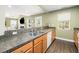 Functional kitchen with modern appliances, ample counter space, and open layout to living room at 1813 Parkland Preserve Ln, Charleston, SC 29412