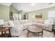 Spacious living room with vaulted ceilings, large sectional sofa, and open layout at 1813 Parkland Preserve Ln, Charleston, SC 29412