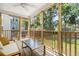 Screened porch boasting a ceiling fan and overlooks a well maintained backyard at 1813 Parkland Preserve Ln, Charleston, SC 29412