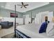 Large bedroom with a four-poster bed, sitting area, and a walk-in closet at 1821 Mead Ln, Johns Island, SC 29455