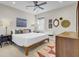 Bright bedroom with white bedding, modern decor, ceiling fan, and neutral-toned walls for a relaxing and inviting space at 1821 Mead Ln, Johns Island, SC 29455