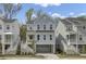 Charming two-story coastal home with a covered porch, white railings, and a convenient ground-level garage at 1821 Mead Ln, Johns Island, SC 29455