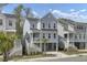 Charming two-story coastal home with a covered porch, white railings, and a convenient ground-level garage at 1821 Mead Ln, Johns Island, SC 29455