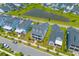 Aerial view of a community featuring houses with porches and a central pond at 1828 Agate Bay Dr, Mount Pleasant, SC 29466