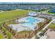 Aerial view of a community pool with beach entry and lush landscaping at 1828 Agate Bay Dr, Mount Pleasant, SC 29466
