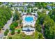 Aerial view of a community pool surrounded by lush landscaping and amenities at 1828 Agate Bay Dr, Mount Pleasant, SC 29466