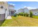 Fenced backyard with a playset and manicured landscaping at 1828 Agate Bay Dr, Mount Pleasant, SC 29466