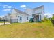 Fenced backyard with a playset and manicured landscaping at 1828 Agate Bay Dr, Mount Pleasant, SC 29466