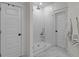 Bright and modern bathroom featuring a glass-enclosed shower, marble floors and clean white finishes at 1828 Agate Bay Dr, Mount Pleasant, SC 29466