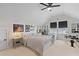 Upstairs bedroom with a ceiling fan, guitars on the wall, and a cozy sitting area at 1828 Agate Bay Dr, Mount Pleasant, SC 29466