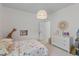 Bright bedroom featuring a playful princess-themed comforter, a round mirror, and a white dresser at 1828 Agate Bay Dr, Mount Pleasant, SC 29466