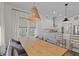 Dining area featuring a wooden table with an eat-in-kitchen island and stainless steel appliances at 1828 Agate Bay Dr, Mount Pleasant, SC 29466