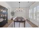 Elegant dining room featuring a long table and modern chandelier at 1828 Agate Bay Dr, Mount Pleasant, SC 29466