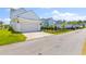 Detached garage with a wide driveway, offering ample parking and storage space at 1828 Agate Bay Dr, Mount Pleasant, SC 29466
