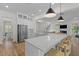 Bright, open kitchen featuring a large island with a quartz countertop and stainless steel appliances at 1828 Agate Bay Dr, Mount Pleasant, SC 29466