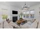 Bright living room featuring a fireplace and large windows letting in lots of natural light at 1828 Agate Bay Dr, Mount Pleasant, SC 29466