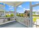 Inviting porch with a cushioned bench and a view of a playground and the neighborhood at 1828 Agate Bay Dr, Mount Pleasant, SC 29466