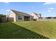 This expansive backyard features lush green grass, offering ample space for activities at 183 Cypress Forest Dr, Moncks Corner, SC 29461