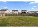 The large backyard, enclosed with a wooden fence, provides great privacy and space at 183 Cypress Forest Dr, Moncks Corner, SC 29461
