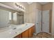 Bathroom featuring double sinks, tile floor, and a large mirror at 183 Cypress Forest Dr, Moncks Corner, SC 29461