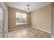 Bright dining area featuring tile floors, a sliding glass door, and a modern light fixture at 183 Cypress Forest Dr, Moncks Corner, SC 29461