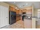 Well-equipped kitchen featuring granite countertops, stainless steel appliances, and wood cabinets at 183 Cypress Forest Dr, Moncks Corner, SC 29461